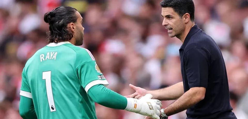 Goalkeeper David Raya receiving instructions from coach