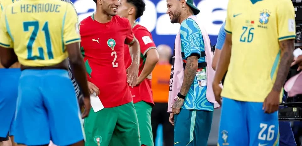 Players from Morocco and Brazil interacting on the field
