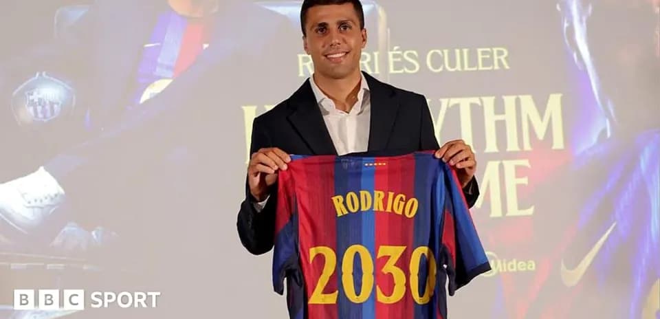 Player holding FC Barcelona jersey at presentation