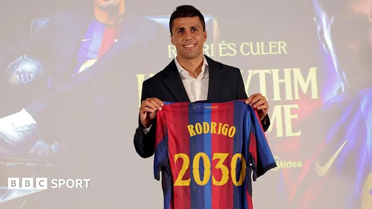 Player holding FC Barcelona jersey at presentation