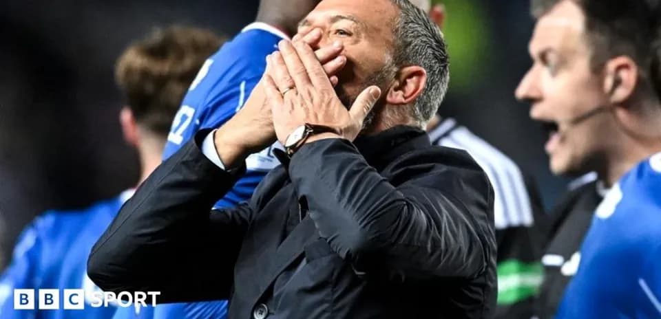 Coach gesturing passionately during match incident