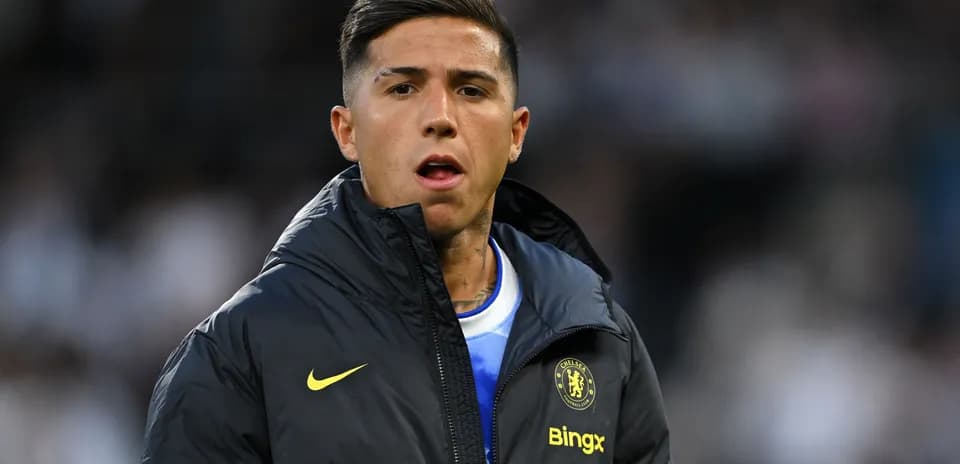 Player in Chelsea jacket on the sidelines