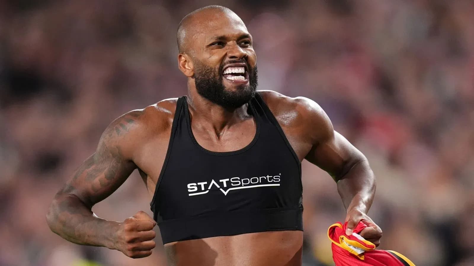 Athlete celebrating with jersey during competition