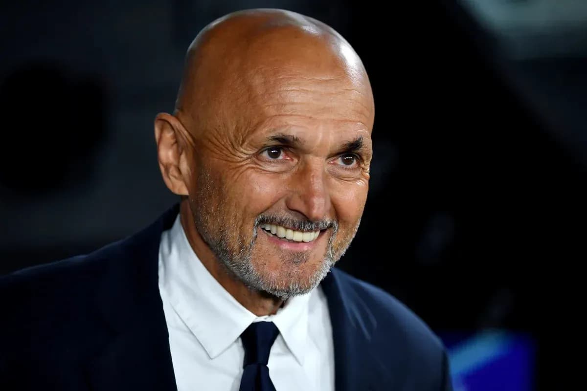 Coach smiling during a press conference event
