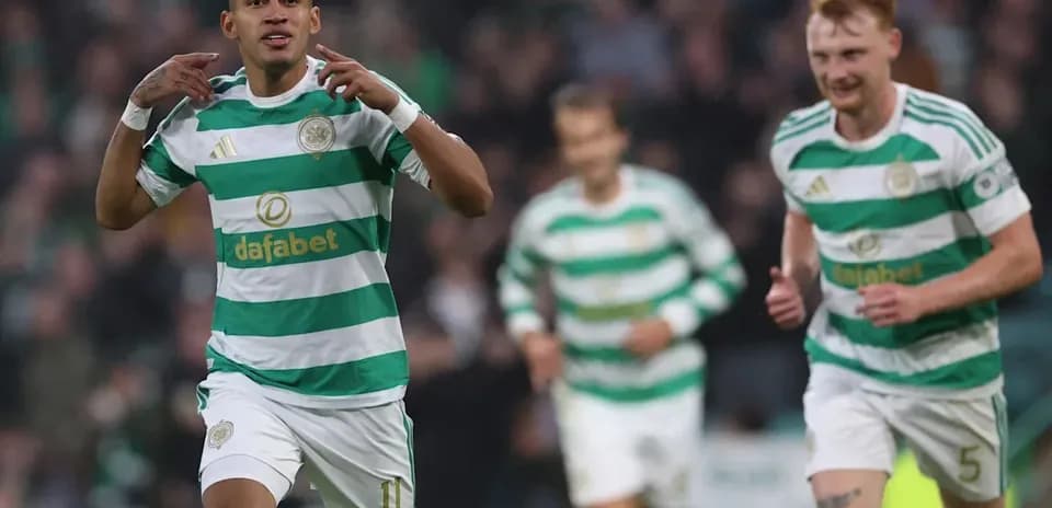 Celtic players celebrating a goal during match