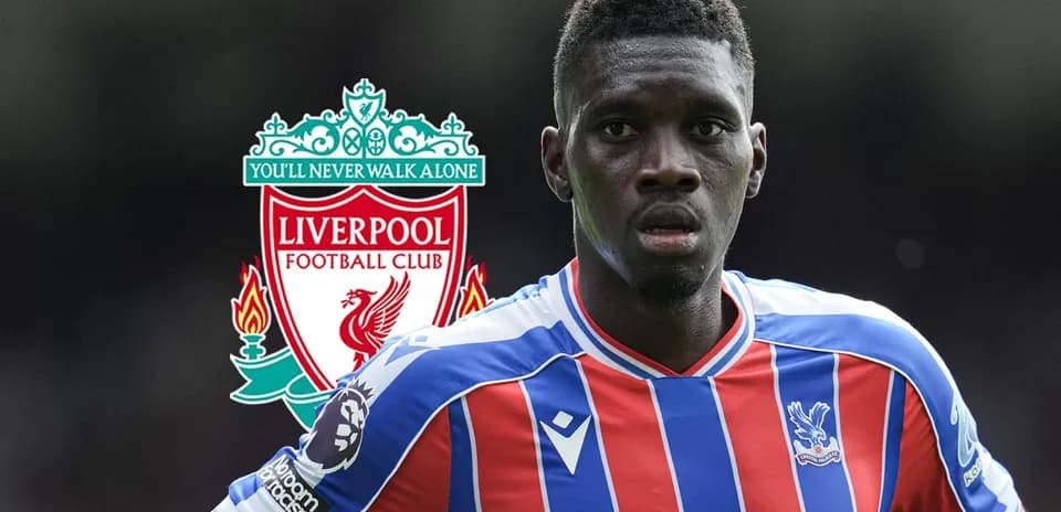 Crystal Palace player in front of Liverpool logo