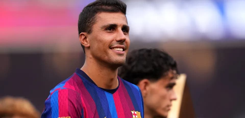 Barcelona player smiling during trophy presentation