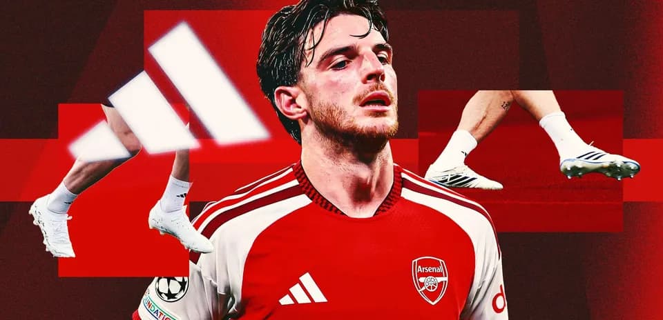 Player in Arsenal kit with Adidas logo and cleats