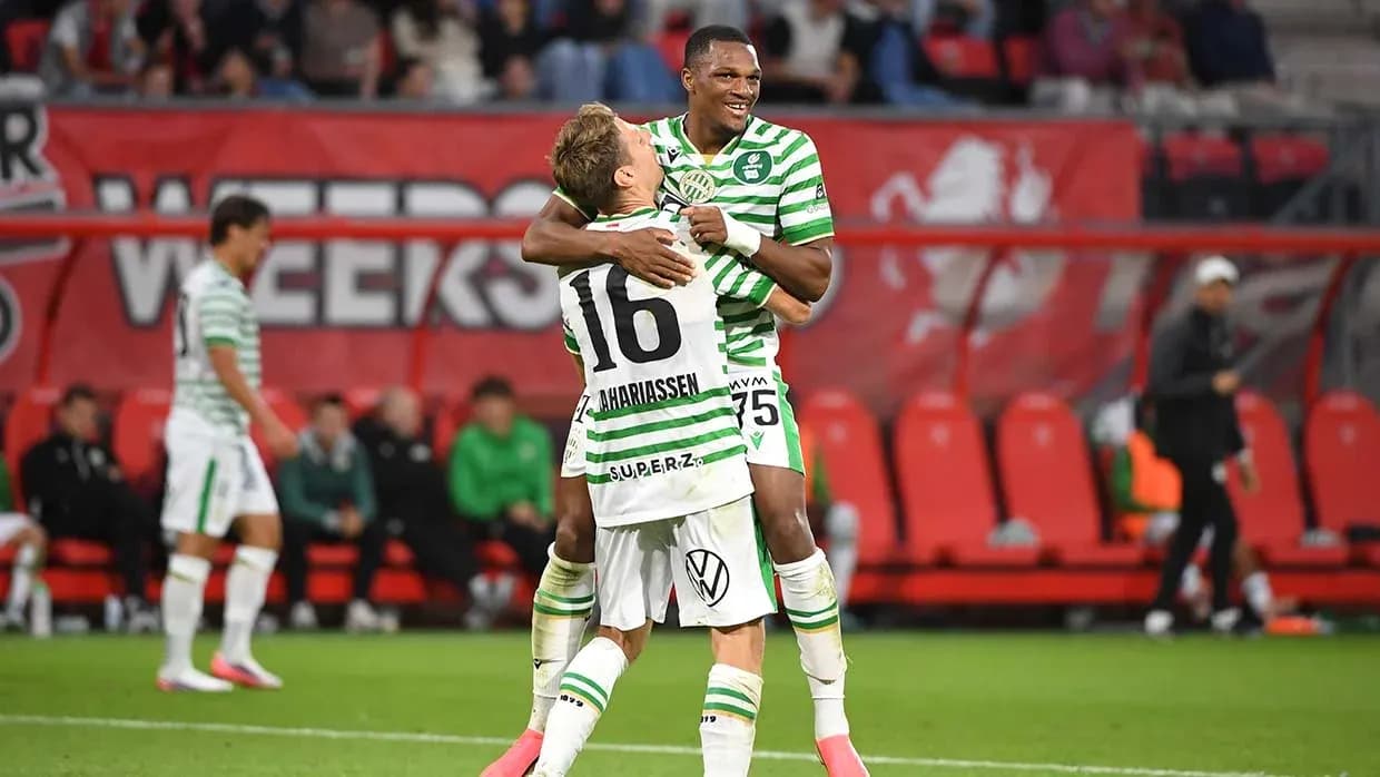Players celebrating during Ferencvarosi TC match