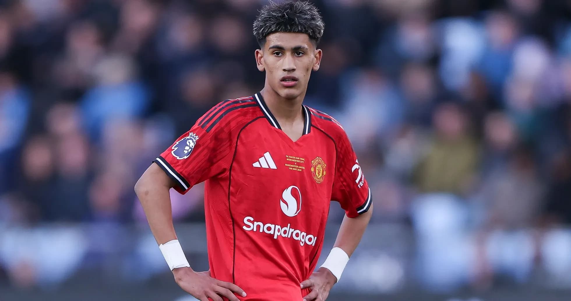 Young player in Manchester United kit on field