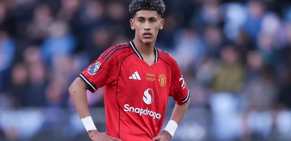 Young player in Manchester United kit on field
