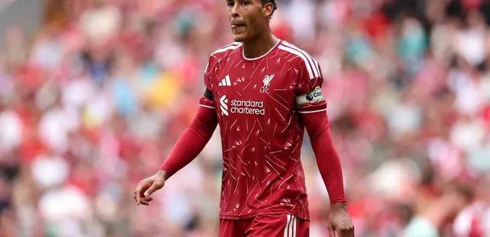 Liverpool player wearing red kit during match