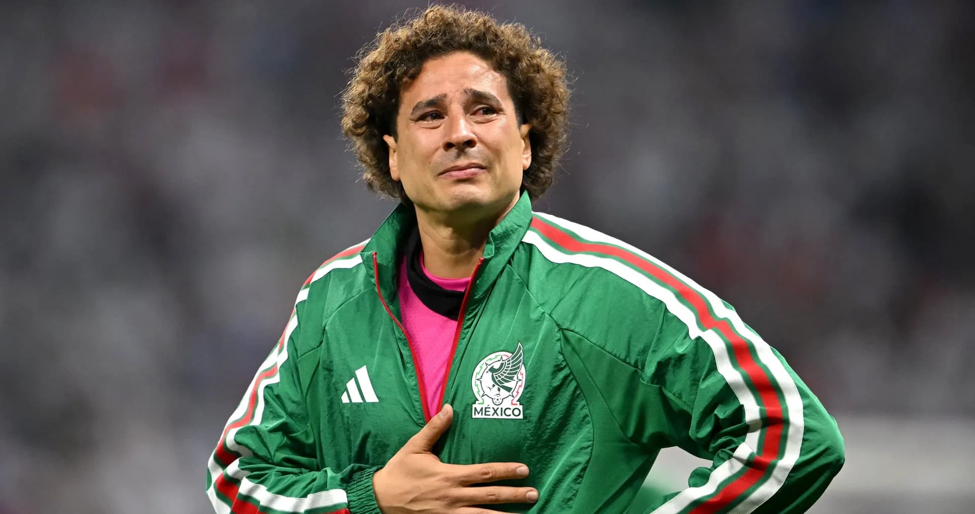 Goalkeeper wearing Mexico jacket during match