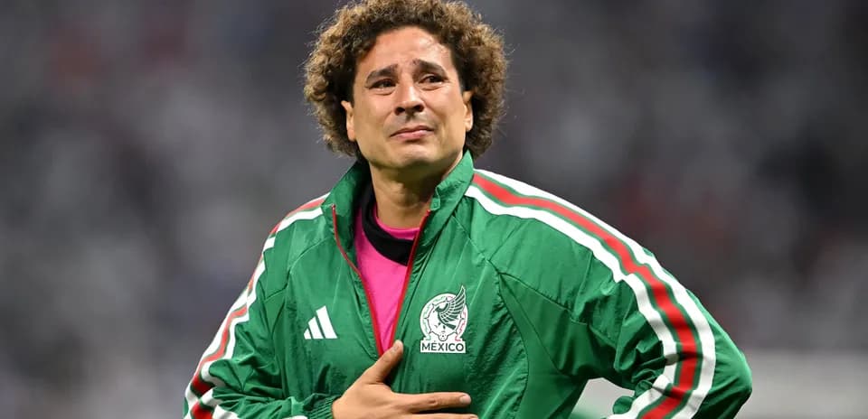 Goalkeeper wearing Mexico jacket during match