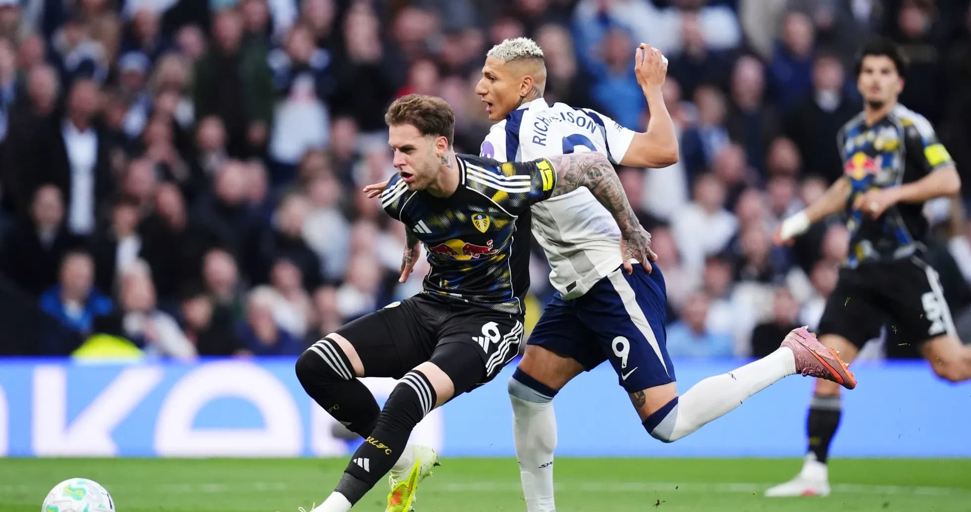 Leeds player tackled by Tottenham striker