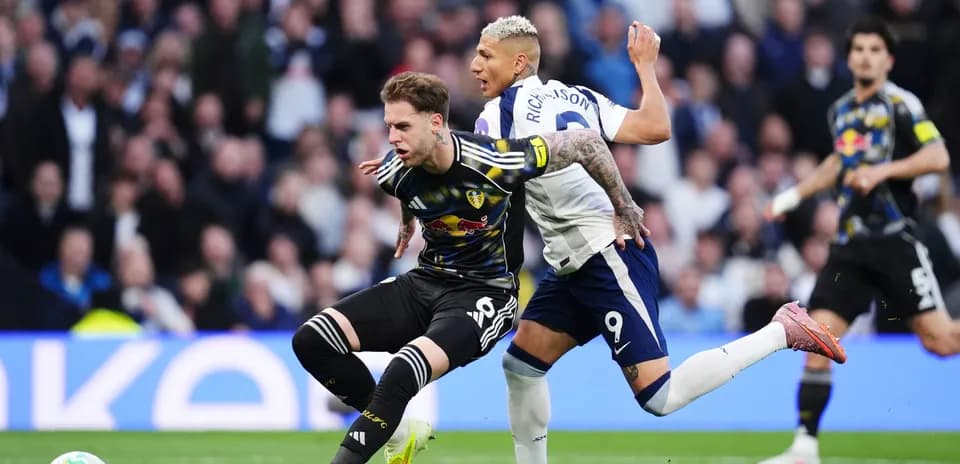 Leeds player tackled by Tottenham striker