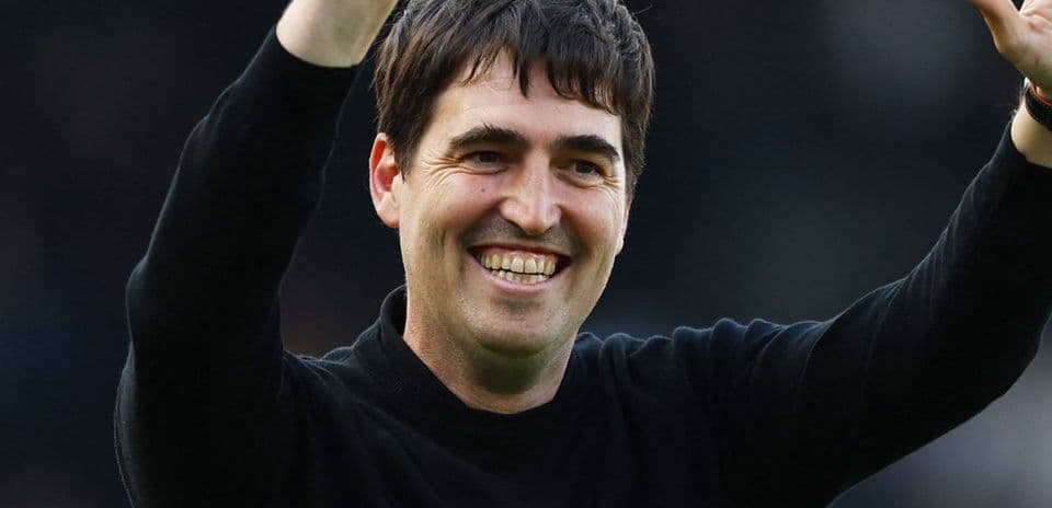 Manager celebrating with raised hand and smile