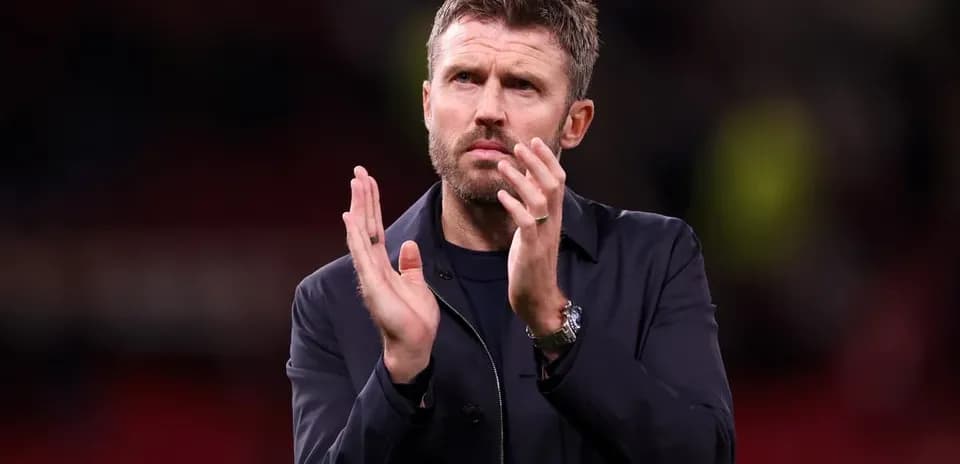Coach applauding fans after the match