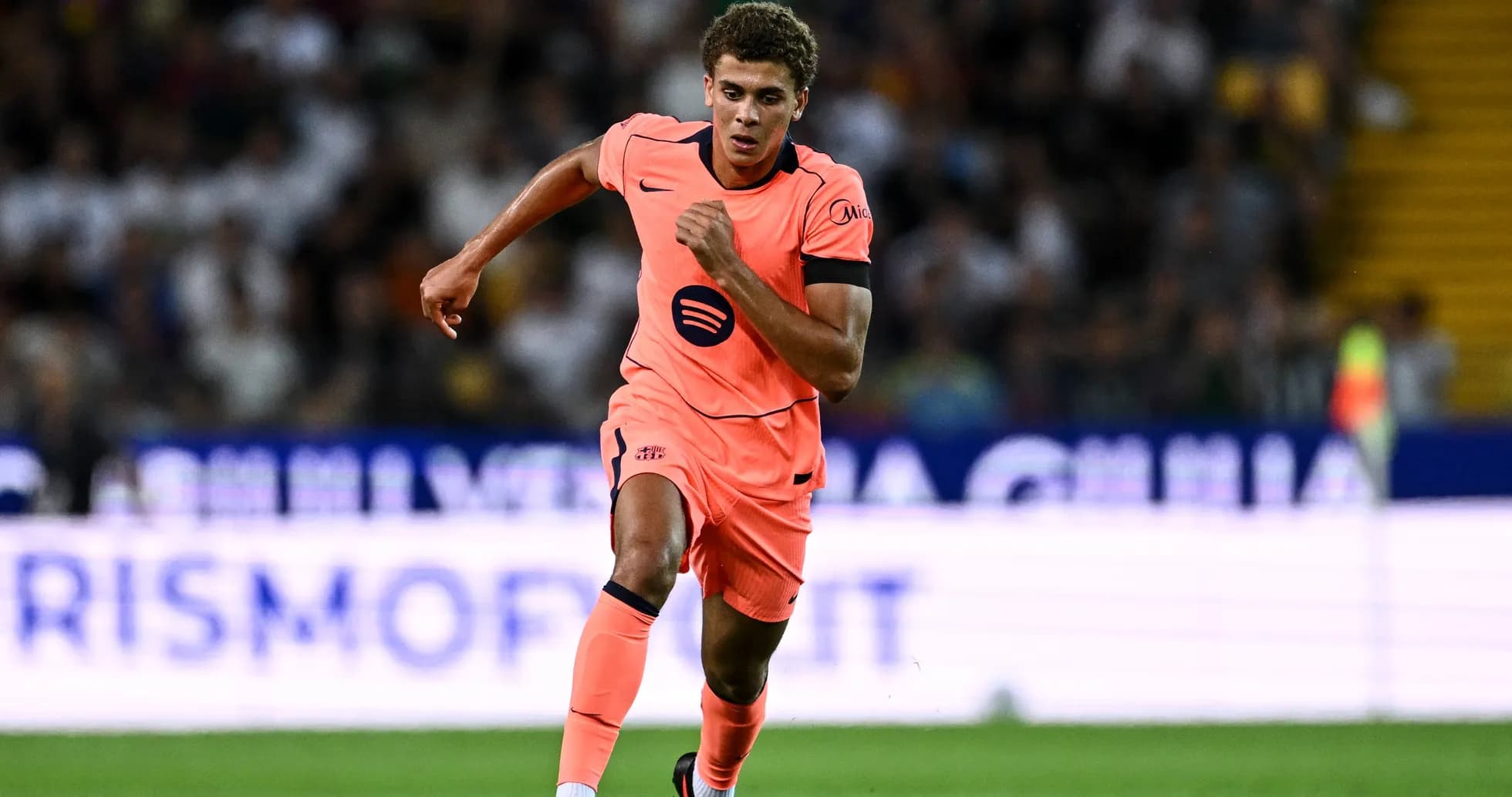 Player running with ball during match