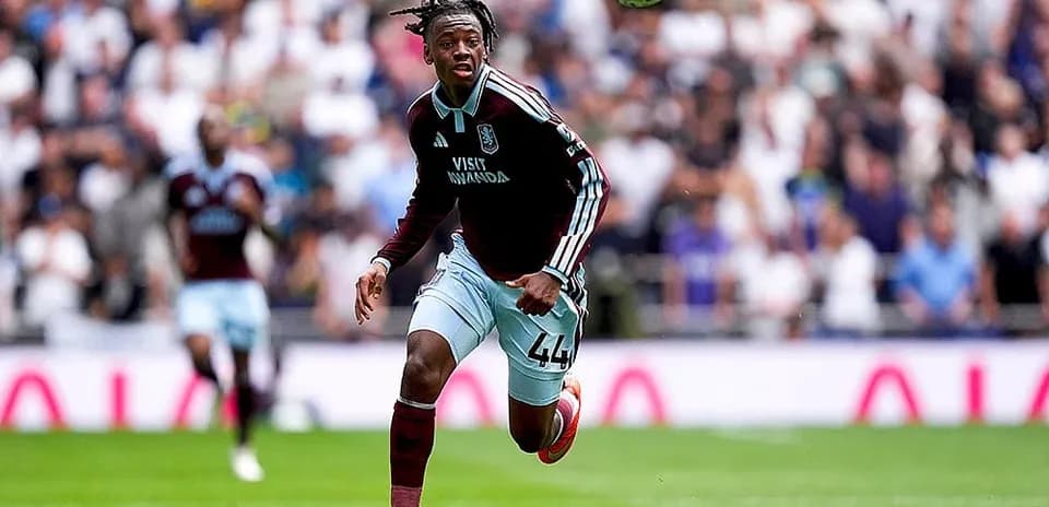 Aston Villa player chasing the ball during match