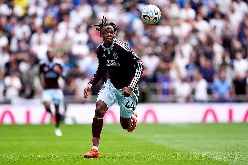Aston Villa player chasing the ball during match