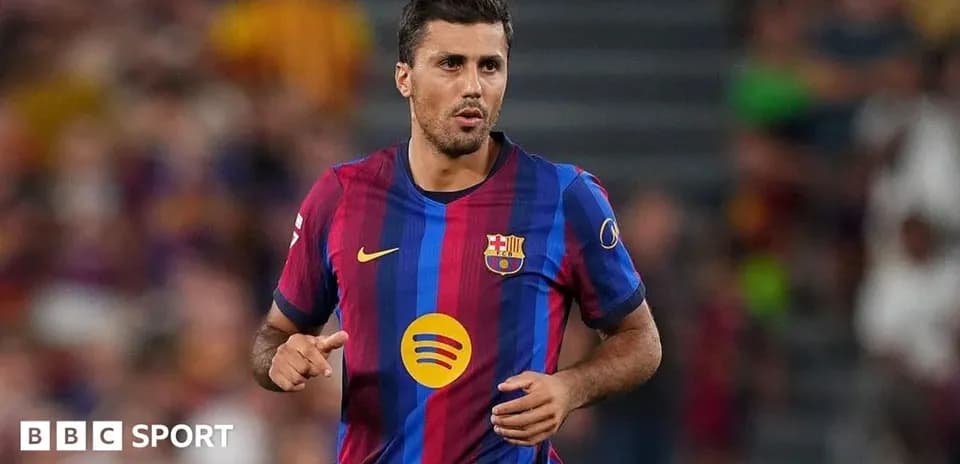 Player running on the pitch wearing FC Barcelona jersey