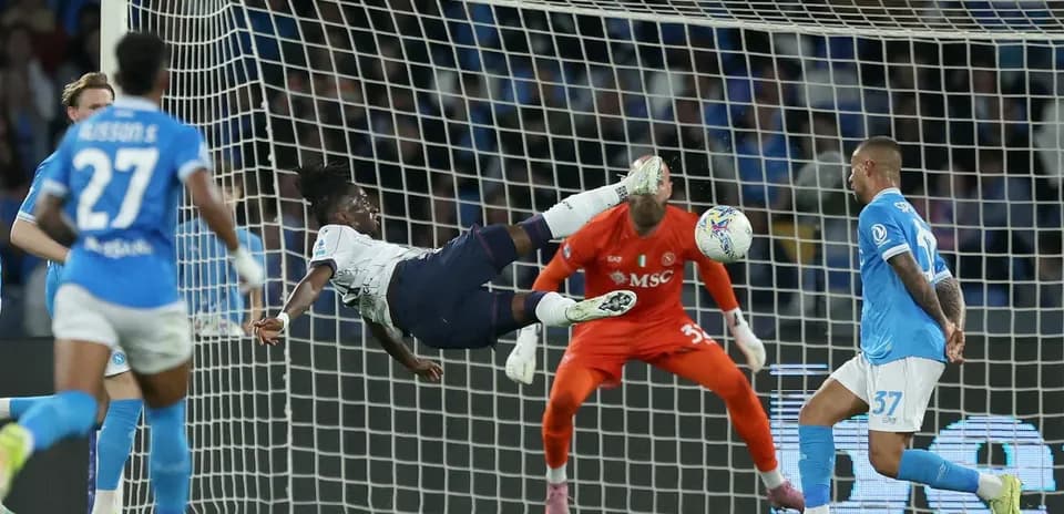 Player attempting an acrobatic shot on goal