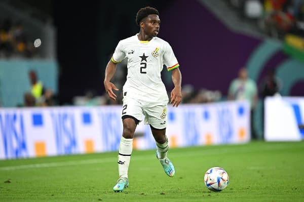 Ghana player dribbling the ball during a match