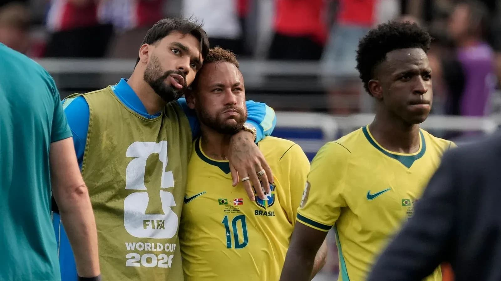 Brazilian players in yellow jerseys after a match