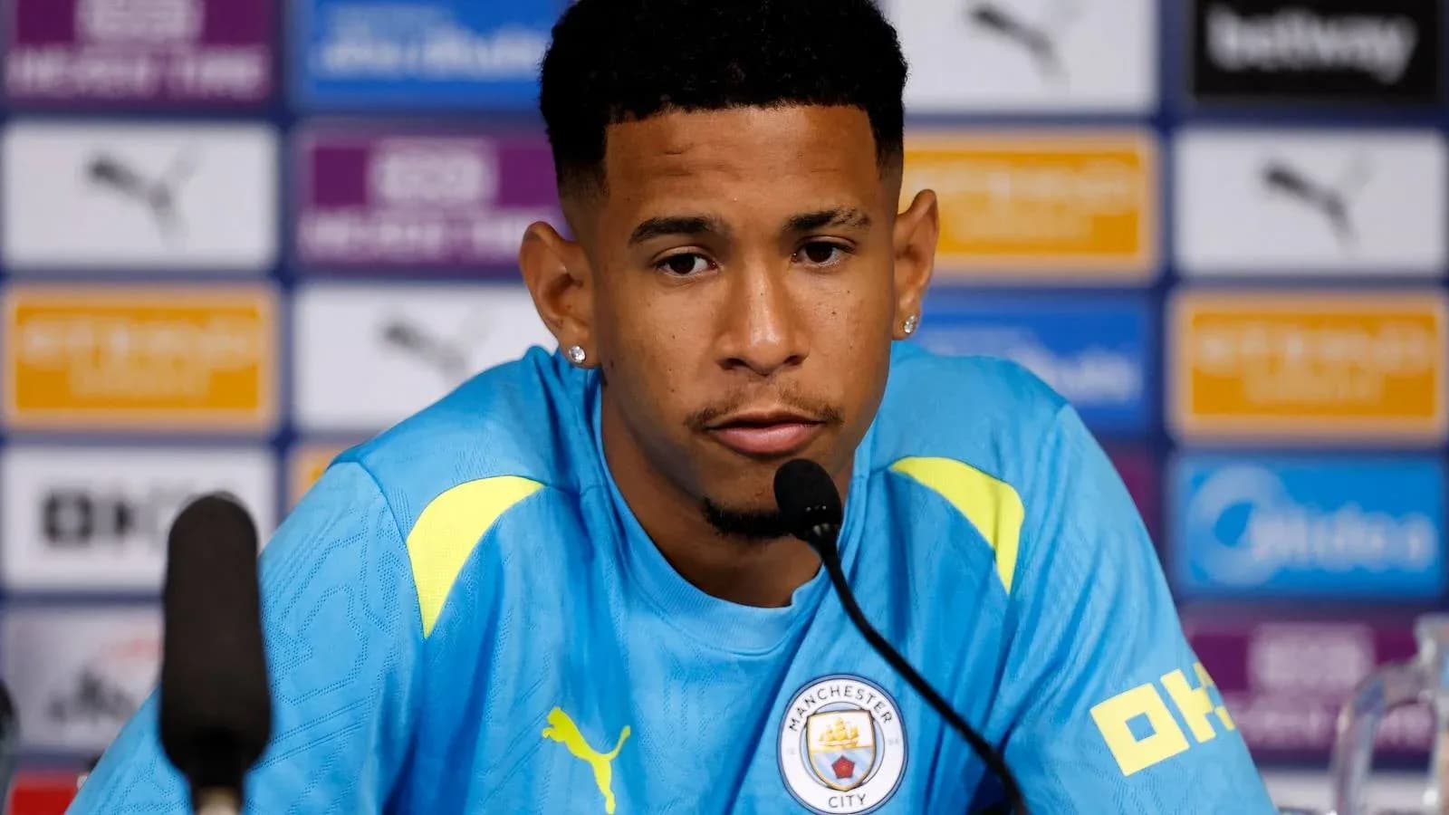 Player at press conference speaking into microphone