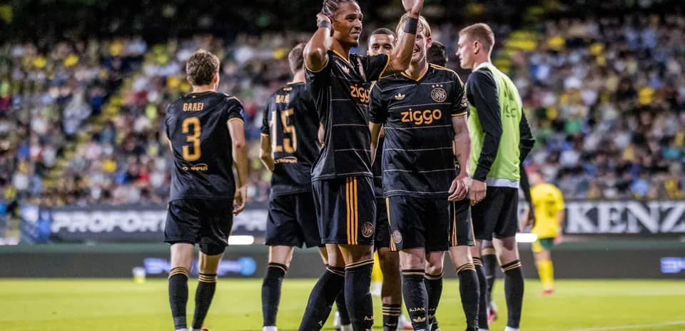 Ajax players celebrating a goal during a match