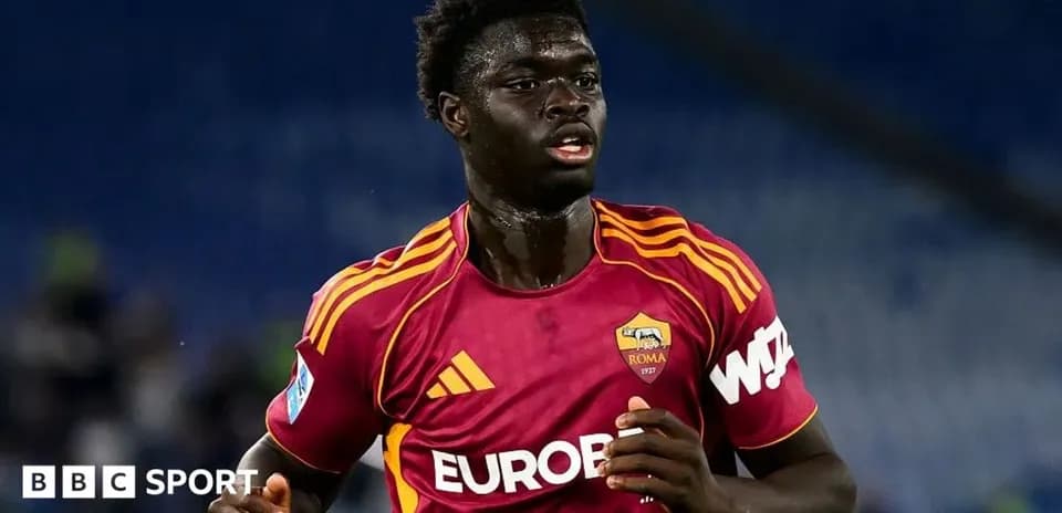 Player in AS Roma kit running during match