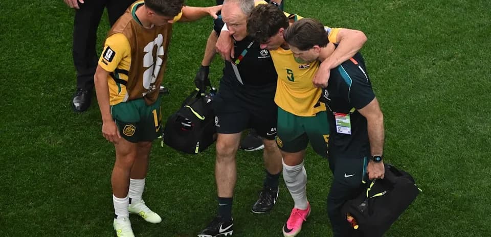 Player receiving assistance after an injury on field
