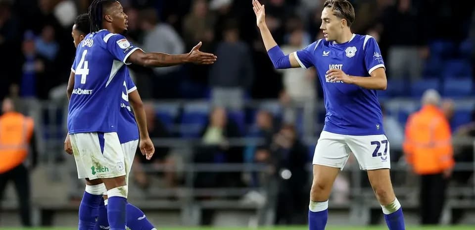 Cardiff City players celebrating a play on the pitch