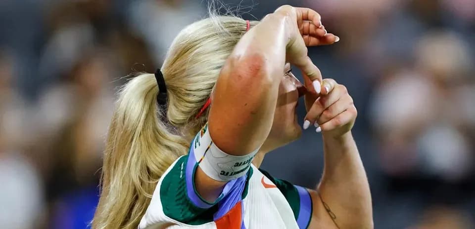 Athlete adjusting her visor during a match