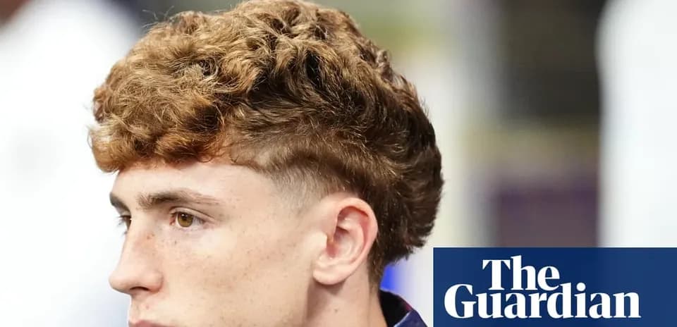 Person with curly hair looking to the side
