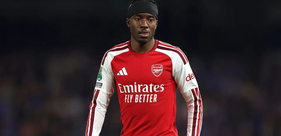 Arsenal player in red kit during match