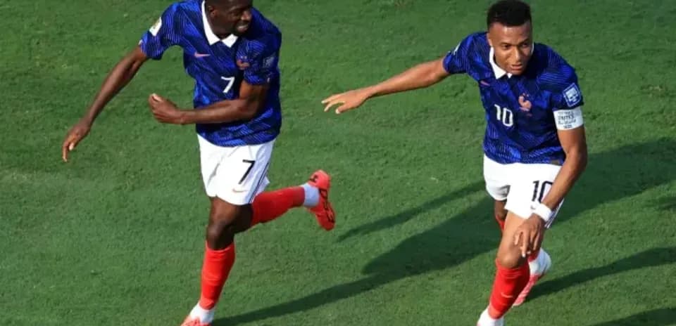 Two players celebrating a goal during a match