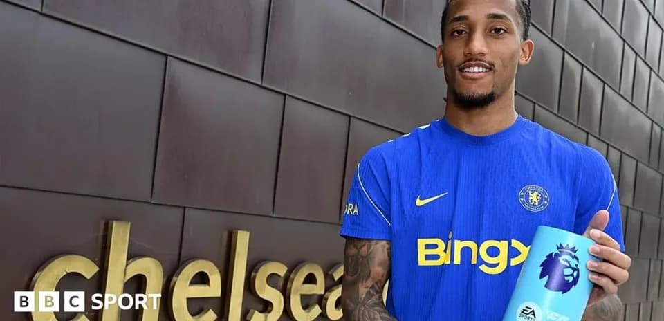 Player holding Premier League award at Chelsea sign