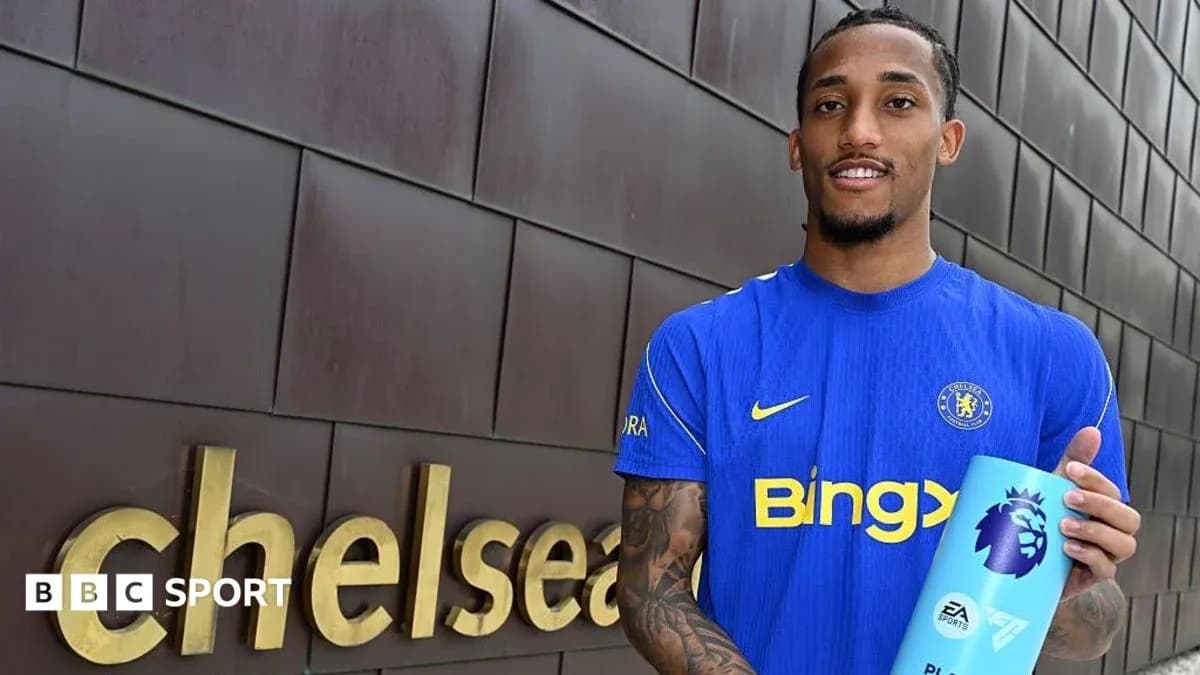 Player holding Premier League award at Chelsea sign