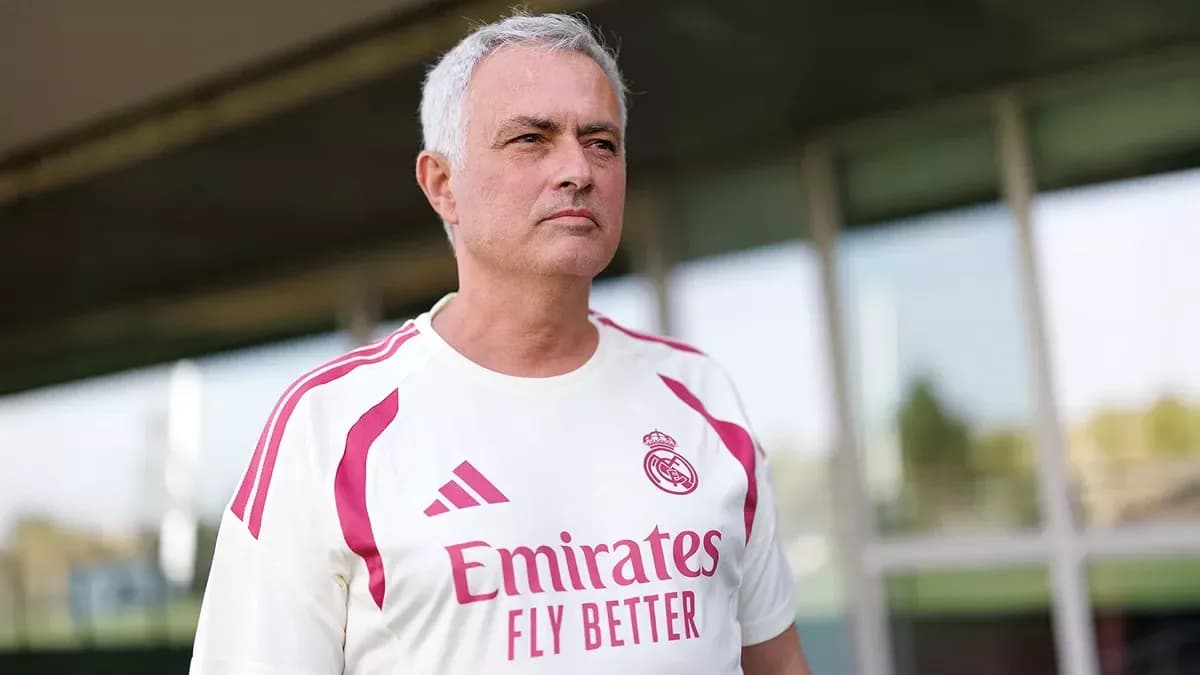 Coach wearing Real Madrid kit at training facility