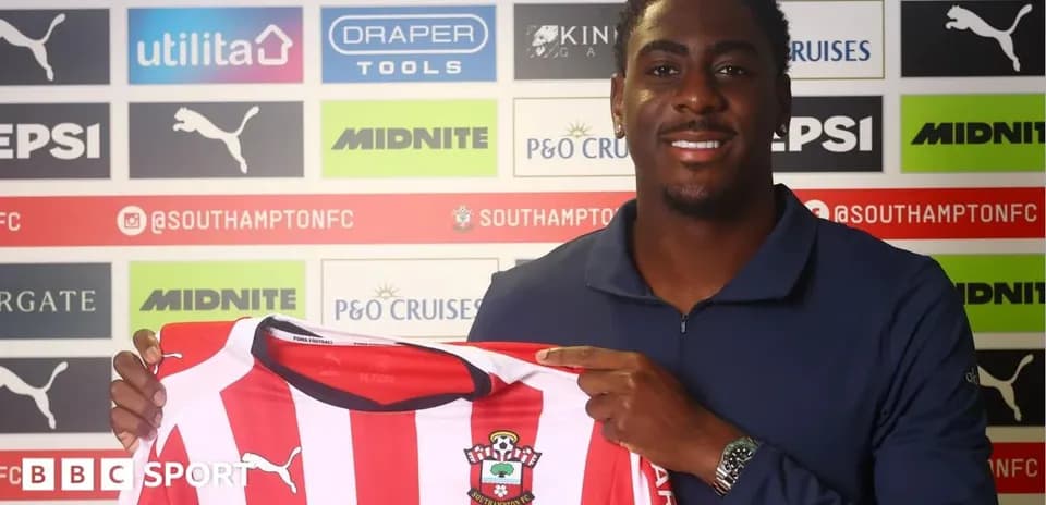 Player holding Southampton FC shirt during signing event
