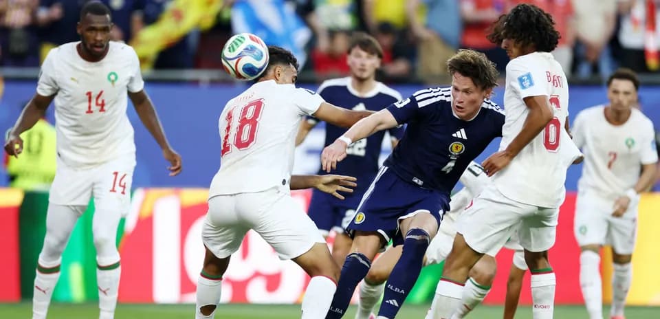 Players from Scotland and Morocco competing for the ball