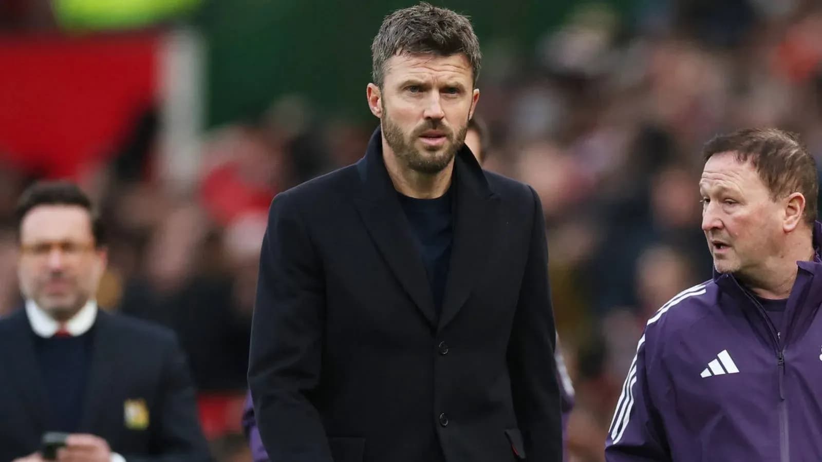 Coach walking on the sideline during match