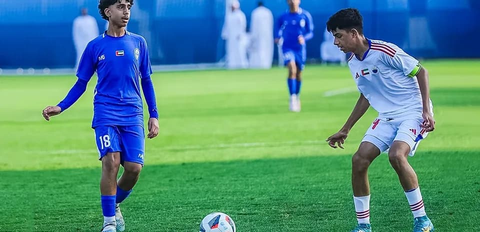 Ittihad Kalba U23 player dribbling during match