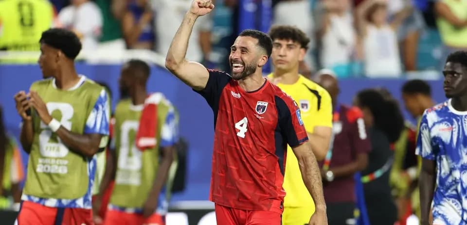 Player celebrating after match with teammates nearby