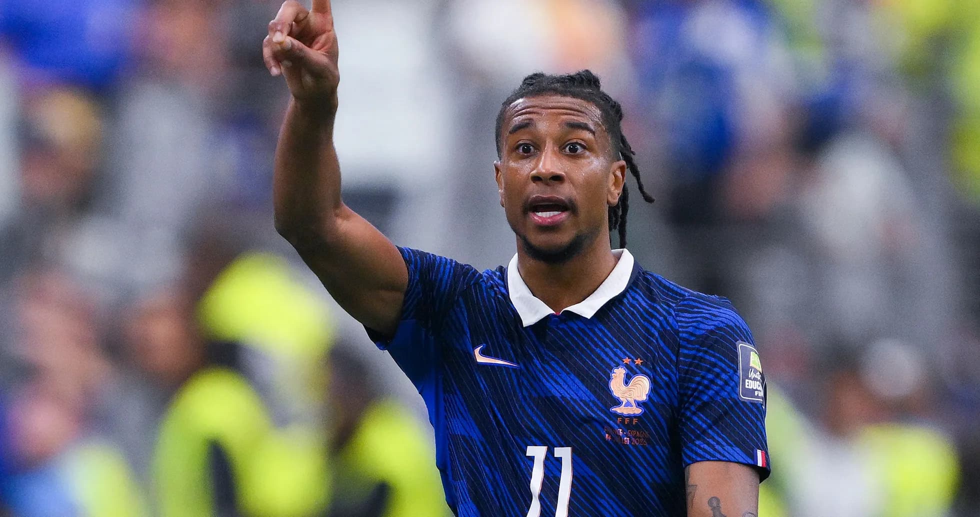 Player gesturing during international football match