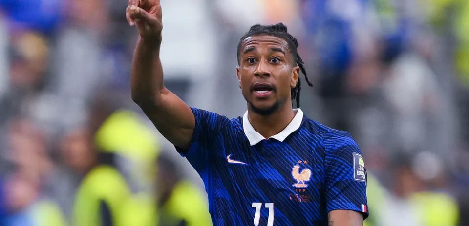 Player gesturing during international football match