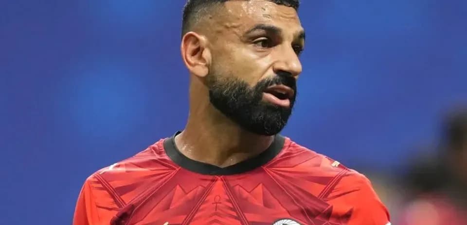Football player in red jersey during match