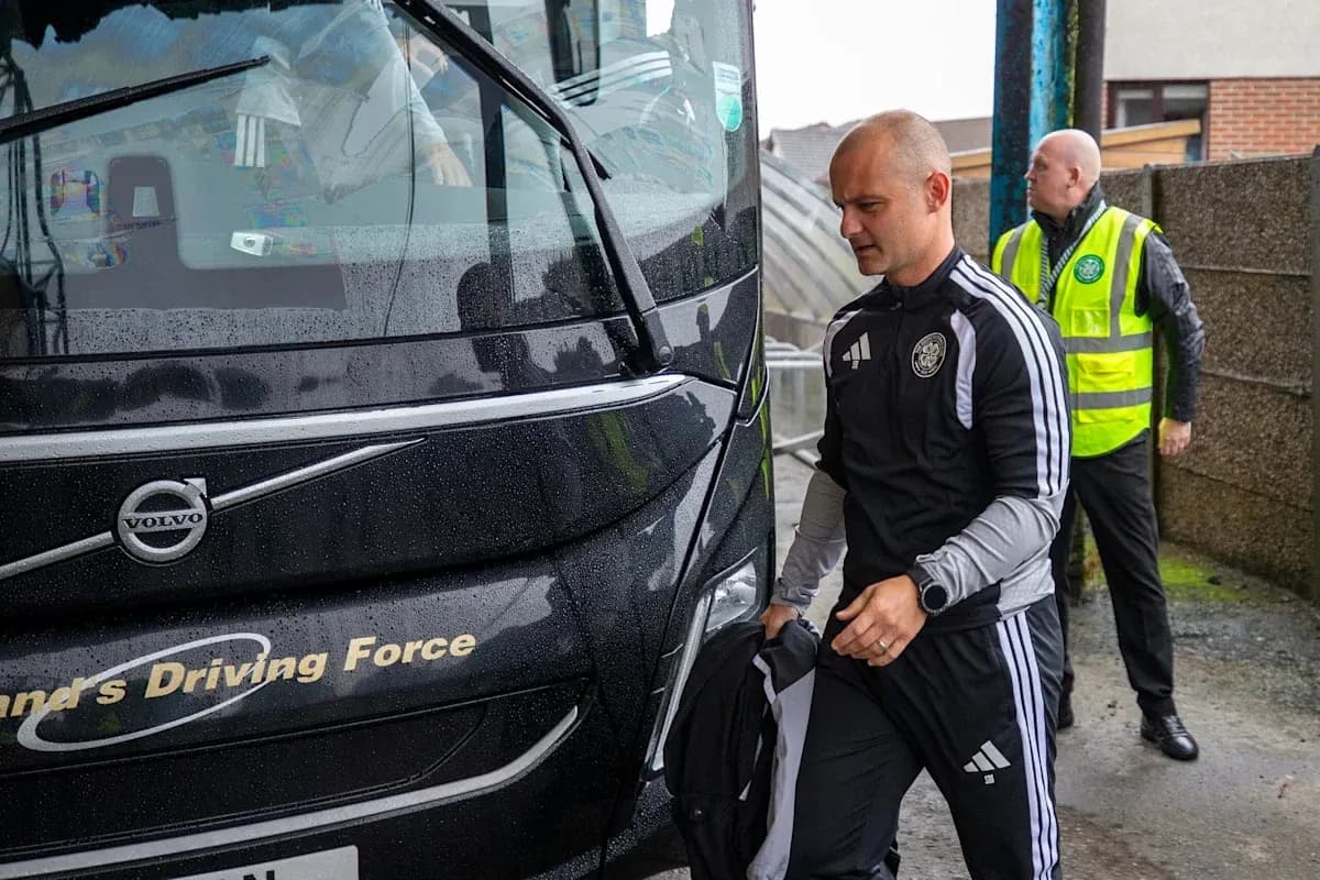 Coach arriving at venue with staff members